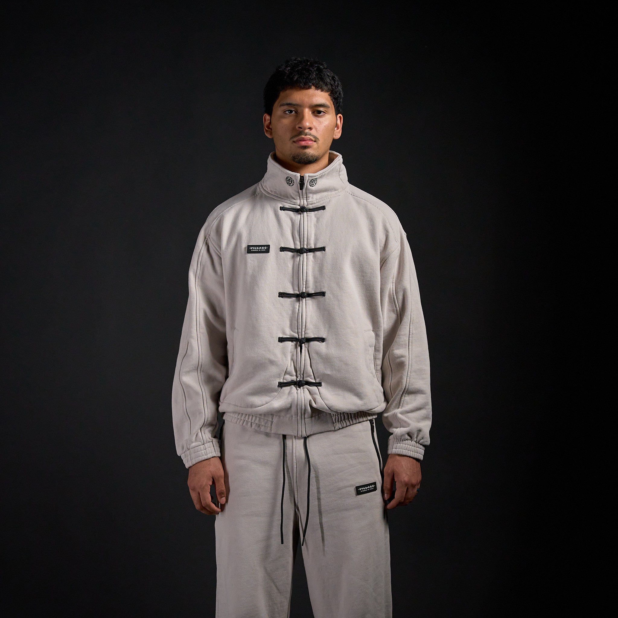 Tang Warmup Jacket in TWILIGHT bone, front view on model | Village Hidden in Iron