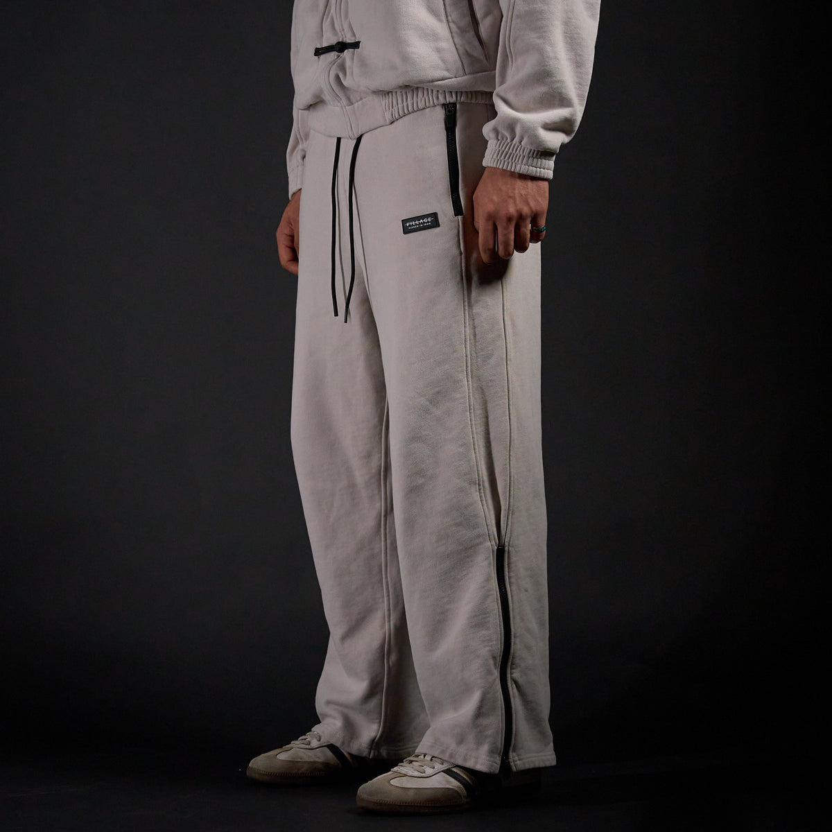 Warmup Pants in TWILIGHT bone, three-quarter view on model | Village Hidden in Iron