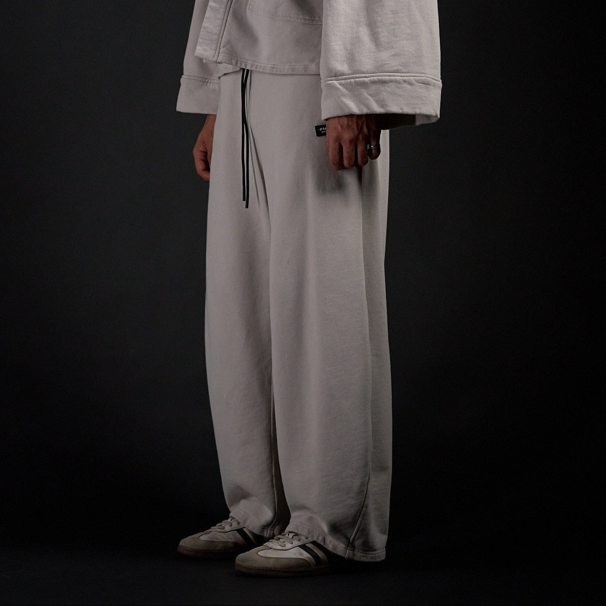 Hakama Sweatpants in TWILIGHT bone, three-quarter view on model | Village Hidden in Iron