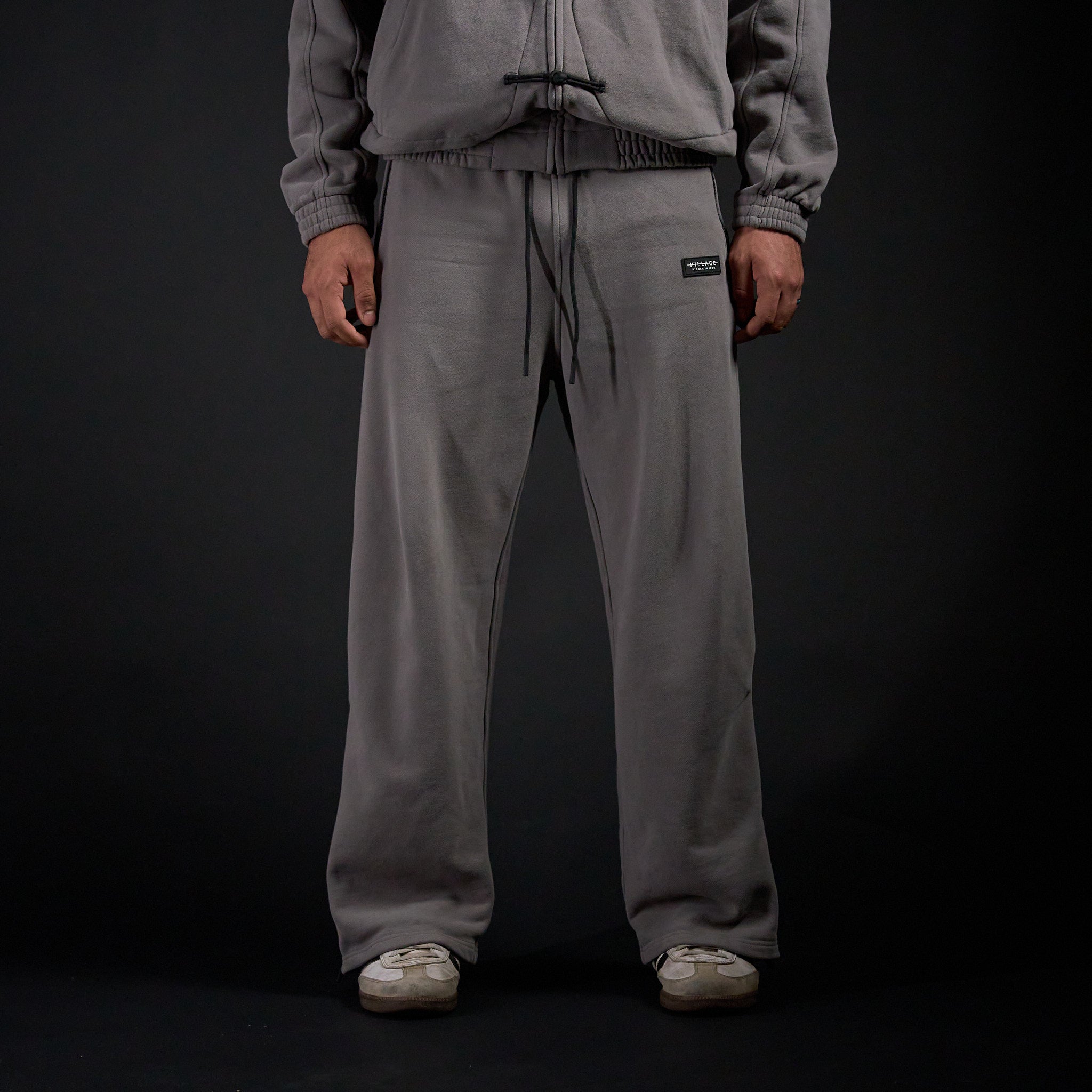 Warmup Pants in DARKSIDE charcoal grey, front view on model | Village Hidden in Iron