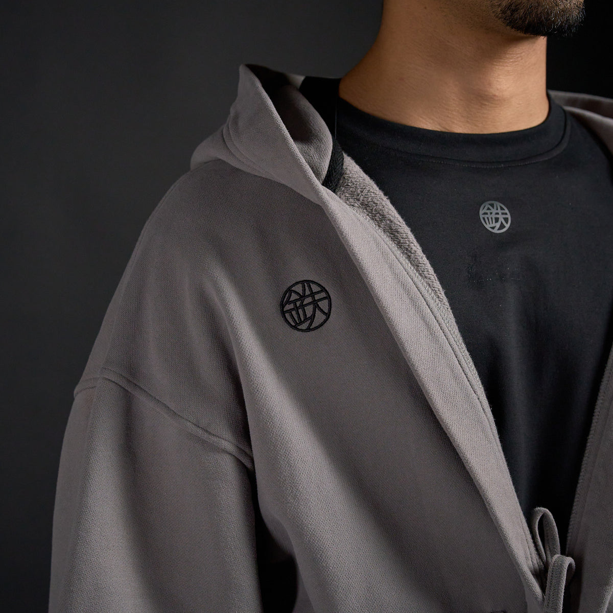 Haori Hoodie in DARKSIDE charcoal grey, close-up of collar and chest emblem | Village Hidden in Iron