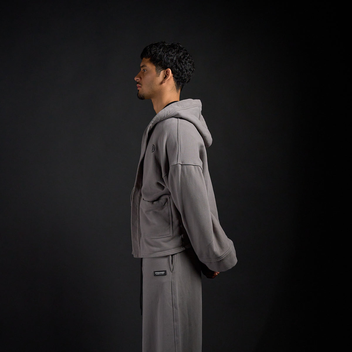 Haori Hoodie in DARKSIDE charcoal grey, side profile on model | Village Hidden in Iron