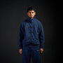 Tang Warmup Jacket in MIDNIGHT navy, front view on model | Village Hidden in Iron