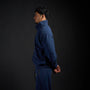 Tang Warmup Jacket in MIDNIGHT navy, side profile on model | Village Hidden in Iron