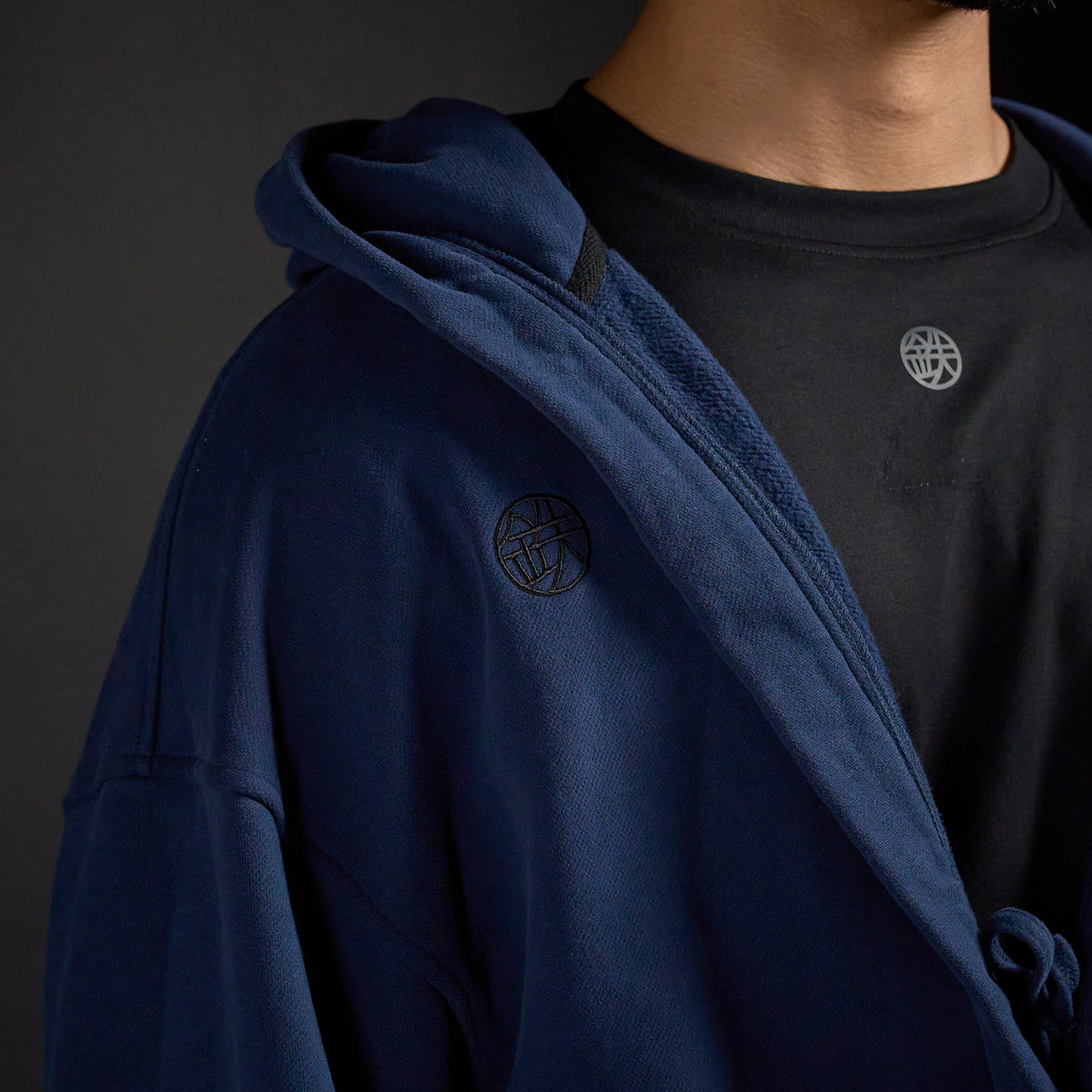 Haori Hoodie in MIDNIGHT navy, close-up of collar and chest emblem | Village Hidden in Iron