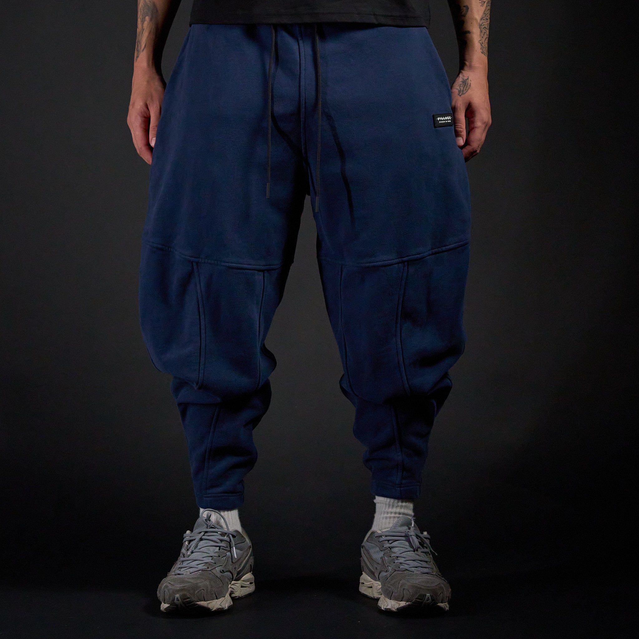 Tobi Sweatpants in MIDNIGHT navy, front view on model | Village Hidden in Iron