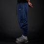 Tobi Sweatpants in MIDNIGHT navy, side view on model | Village Hidden in Iron