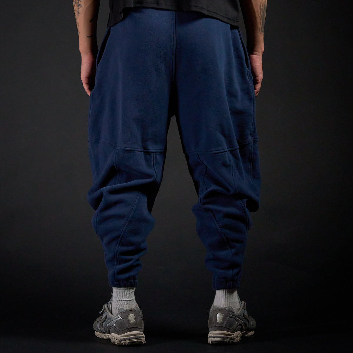 Tobi Sweatpants in MIDNIGHT navy, back view on model | Village Hidden in Iron