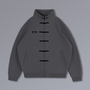 Tang Warmup Jacket in DARKSIDE charcoal grey, flat lay | Village Hidden in Iron