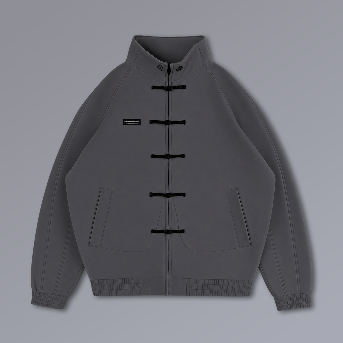 Tang Warmup Jacket in DARKSIDE charcoal grey, flat lay | Village Hidden in Iron